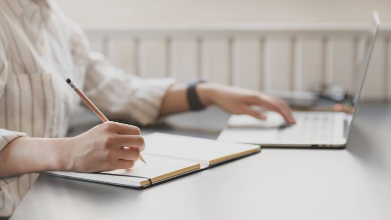 photo-of-person-writing-on-notebook-3758898.jpg